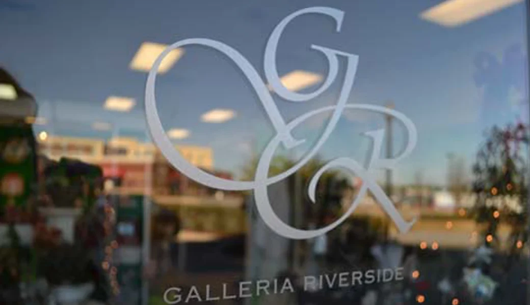 The etched monogram on the Galleria Riverside door